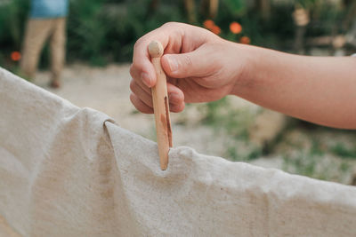 Close-up of hand holding painting