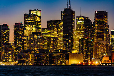 Illuminated buildings in city at night