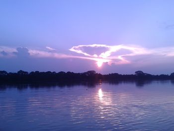 Scenic view of silhouette landscape against sky at sunset