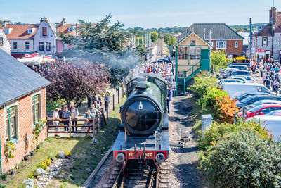 Panoramic view of train in city against sky