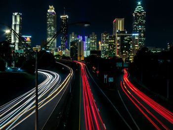 High angle view of light trails on road at night