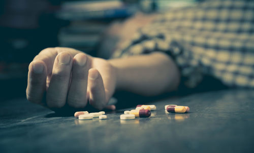 Dead man with medicines lying on floor at home