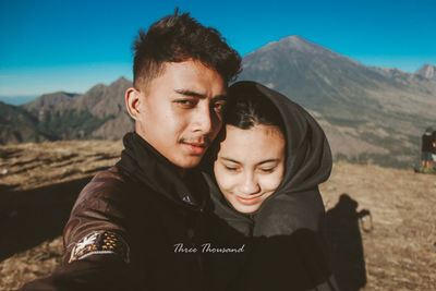 Portrait of man and woman on land