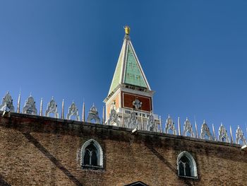 Low angle view of building against clear blue sky