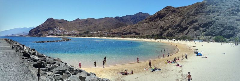 Panoramic view of people on beach