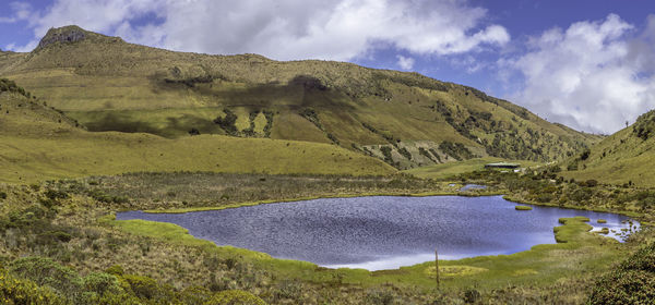 Scenic view of lake and mountains against sky