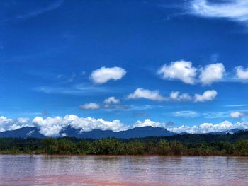 Scenic view of lake against blue sky