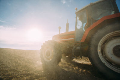 Old tractor working on the field