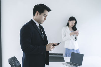 Young man using mobile phone