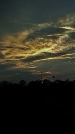 Silhouette trees against sky during sunset