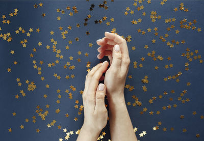 Directly above shot of person hand holding multi colored background