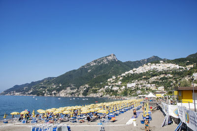 Scenic view of sea against clear blue sky