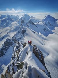 Scenic view of snow covered mountains