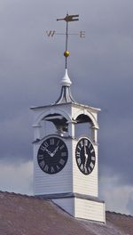 Low angle view of clock tower against sky