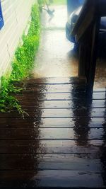 Close-up of wooden railing in water