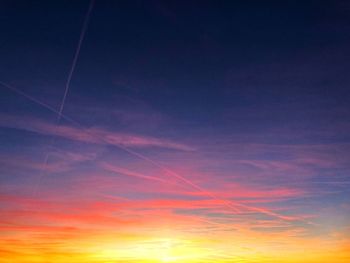 Low angle view of vapor trails in sky