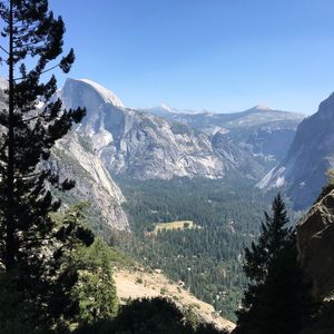 Scenic view of snowcapped mountains against clear blue sky