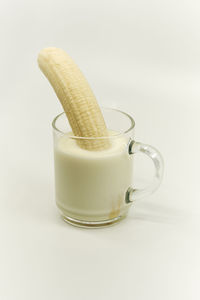 Close-up of beer glass against white background