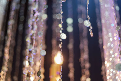 Close-up of illuminated decoration hanging outdoors