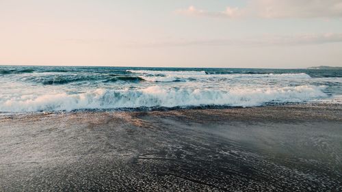 Scenic view of sea against sky at sunset