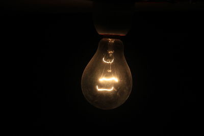 Close-up of illuminated light bulb