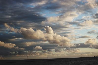 Scenic view of sea against storm clouds