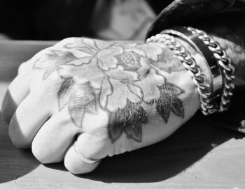 Close-up of hand on table