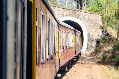 Kalka shimla toy train moving on mountain slopes, beautiful view, one side mountain, one side valley