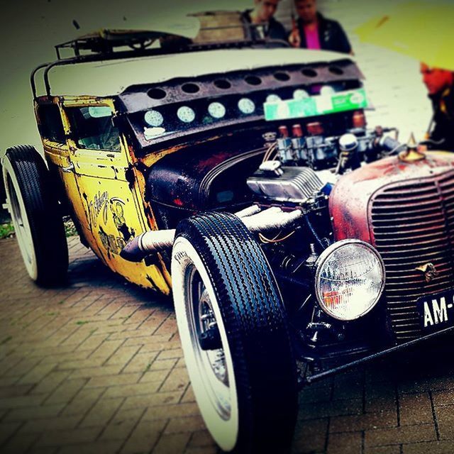 land vehicle, transportation, indoors, old-fashioned, retro styled, mode of transport, stationary, street, table, no people, car, bicycle, parking, high angle view, incidental people, arts culture and entertainment, focus on foreground, wheel, day, close-up