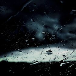 Close-up of water drops on glass