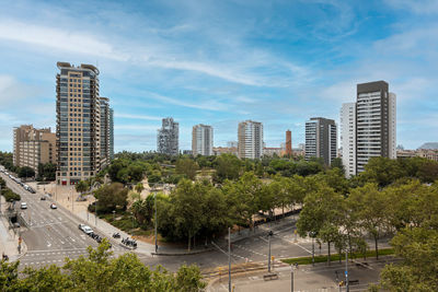 Modern buildings in city against sky