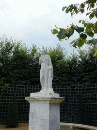 Low angle view of statue against sky