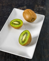 Close-up of fruits in plate on table