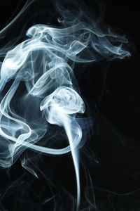 Close-up of smoke against black background