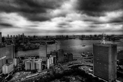 Cityscape against cloudy sky