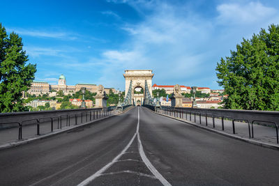 View of bridge against cloudy sky