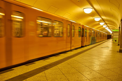 Blurred motion of train at railroad station