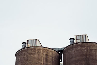 Low angle view of silos