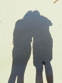 Shadow of people on sand