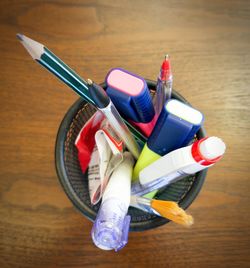 High angle view of multi colored pencils on wooden table