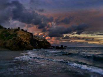 Scenic view of sea against cloudy sky