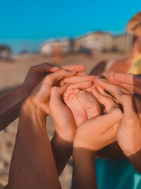 Cropped image of man holding hands