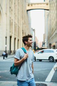 Young man walking in city