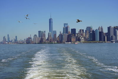 View of sea and buildings in city