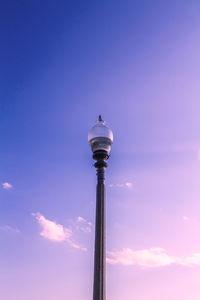 Low angle view of communications tower against sky