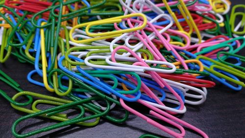 Close-up of colorful paper clips on table in store