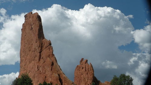 Low angle view of rock formation against sky