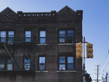 Low angle view of residential building against sky