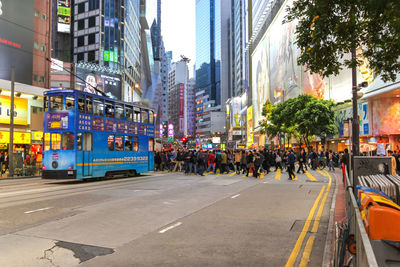 People on road in city