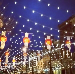 Low angle view of illuminated lights at night